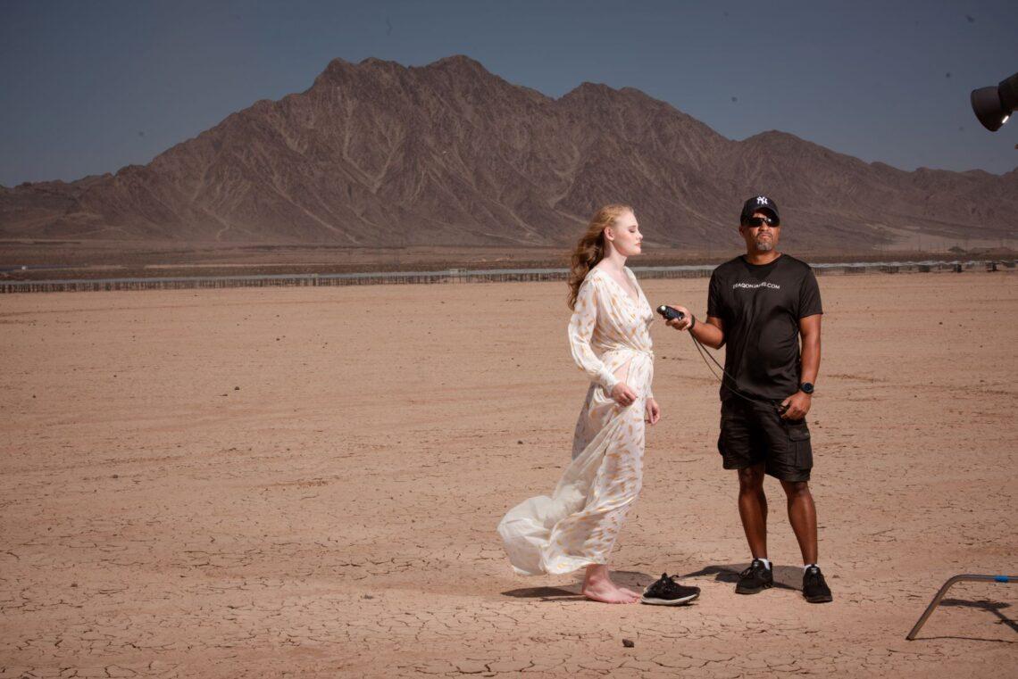 Boudoir Photographer Deaqon James Meters his Neewer vision 5 on the Las Vegas Dry Lake Bed.